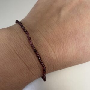 This dainty faceted garnet bracelet will provide a sparkly appearance to your bracelet combination while assisting your body to heal the organs within the Root chakra energy center.