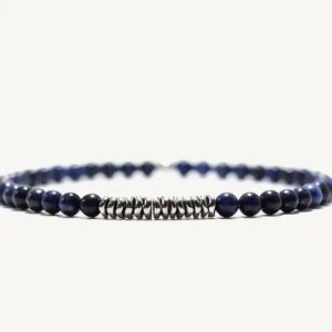 This delicate lapis lazuli with silver strip bracelet will assist your body to heal its brow energy center.