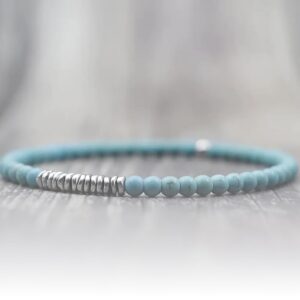 This delicate turquoise with silver strip bracelet will assist your body to heal its Throat energy center.