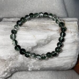 This Diopside bracelet has the energies that will assist speeding up recovery following surgery, injury, or serious illnesses, helping with hormonal balance, acid-alkaline balance, cellular memory, and reproductive health. It will also assist healing inflammation, stress, muscle pains and spasms, the kidneys, and the heart.