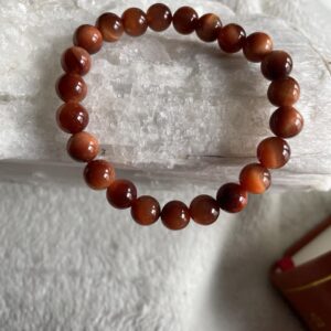 The energies within this orange Tiger's Eye bracelet will assist the body in overall physical weaknesses along with being a protective shield and promoting courage and confidence.