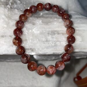 The energies within this red rutilated quartz bracelet protect the wearer from negative vibrations coming from other people. It is considered a good luck charm.