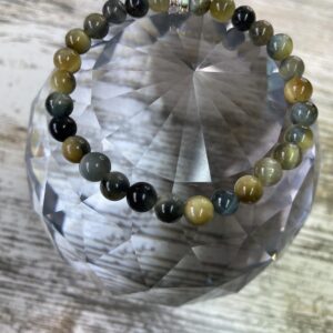 This Yellow & Blue Tiger's Eye Bracelet may assist the body with the following healing needs:• Regulating the circulatory system, soothing abdominal pain, and strengthening bones• Aiding in healing broken bones, improving eyesight, and enhancing overall physical strength and endurance• Promoting empowerment, intuition, strategy, and wisdom• Balancing and harmonizing the energies of the Solar Plexus Chakra, enhancing self-worth, personal power, and confidence• Acting as a protective shield and promoting courage and confidence