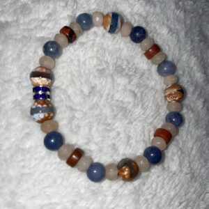 This Cardinal Navajo Sunrise & Sunset 6mm Energy Bracelet has a multitude of healing properties that will assist your body to heal all organs and glands within the root, sacral, and throat chakra energy centers.