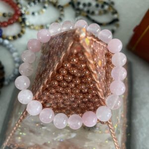 This Rose Quartz 8mm Bracelet has the healing properties that are known to instill Universal Love. Rose Quartz purifies and opens the heart at all levels to promote love, self-love, friendship, deep inner healing, and feelings of peace. Calming and reassuring, it helps to comfort in times of grief. Rose Quartz strengthens and balances the physical heart and circulatory system and releases impurities from body fluids. It hastens recovery, reduces high blood pressure, aids chest and lung problems, heals the kidneys and adrenals, and alleviates vertigo.