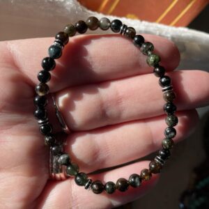This GREEN BLUE ~ Tourmaline & Black AB Crystal Discs 4mm Energy Bracelet will assist the Heart and Throat Chakra organs in your body to heal as they were designed to.
