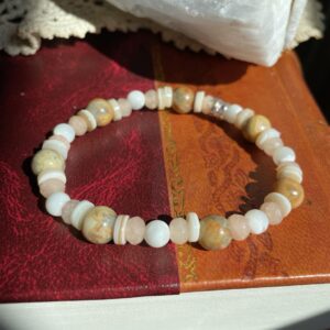 This Irresistible Pink Bliss 8mm Energy Bracelet will assist your body to heal its sacral, solar plexus, and root chakra energy centers.