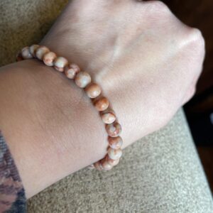 This RED Map Jasper 6mm Energy Bracelet has the healing properties known to promote physical strength, stamina, and endurance, boost energy levels, stimulate the root chakra, which governs feelings of safety and security.